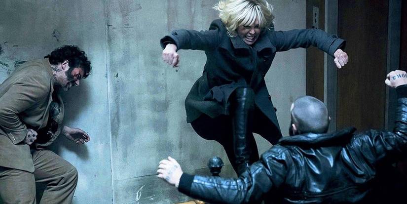 Lorraine (Charlize Theron) kicks a KGB agent down the stairs in Atomic Blonde.