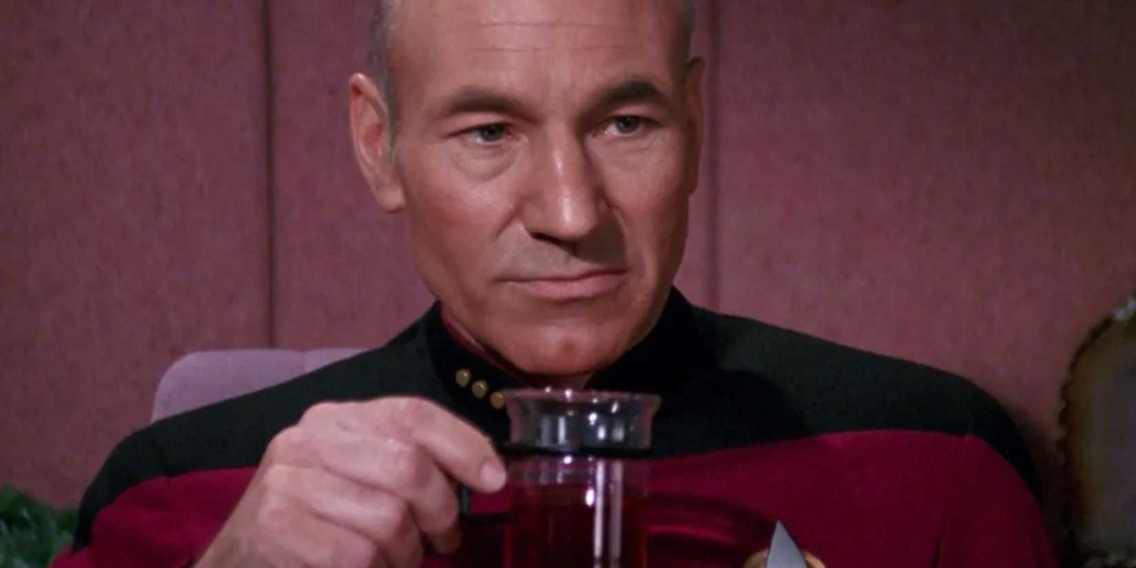 Picard (Patrick Stewart) holds a glass mug of earl grey in Star Trek TNG