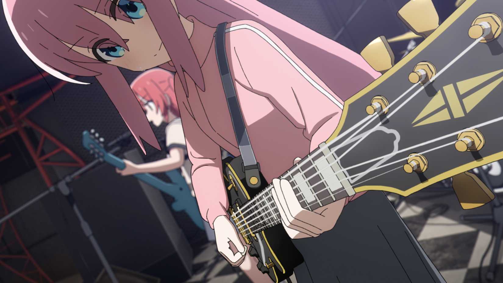 Bocchi and Ikuyo playing the guitar on stage in Bocchi the Rock