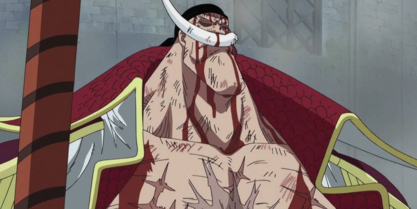 Captain Whitebeard stands with his eyes closed while blood drips down his face during One Piece's Marineford Arc.