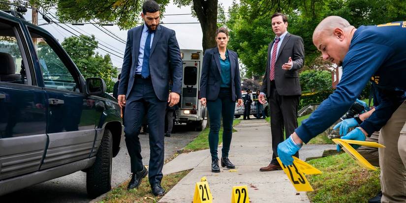 FBI Special Agent Omar Adom 'OA' Zidan (Zeeko Zaki) and Maggie Bell (Missy Peregrym) investigate a crime scene with Michael Mosley as U.S. Marshal Paul Ackerman in FBI episode "Compromised"