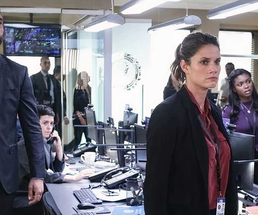 FBI Special Agents Omar Adom 'OA' Zidan (Zeeko Zaki) and Maggie Bell (Missy Peregrym) review evidence with FBI Analyst Kristen Chazal (Ebonee Noel) and Special Agent in Charge Dana Mosier (Sela Ward) in FBI episode "Doomsday"