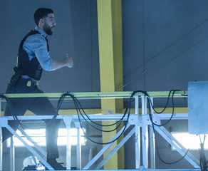 FBI Special Agent Omar Adom 'OA' Zidan (Zeeko Zaki) running after a suspect in FBI episode "Doomsday"