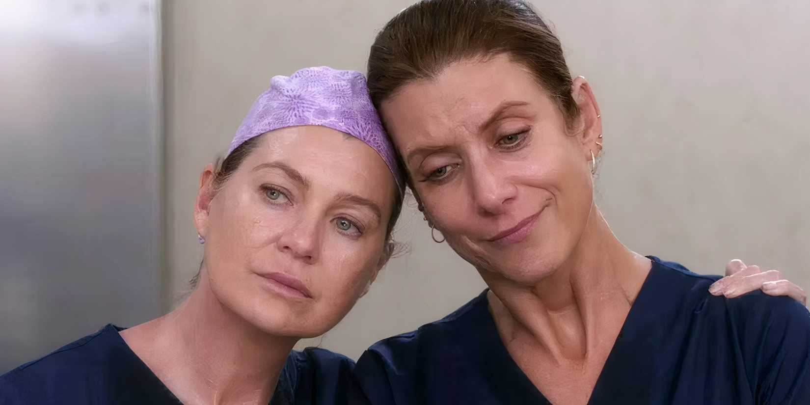 Meredith Grey and Addison Montgomery lean their heads against each other after a sad elevator convo in Grey's Anatomy.