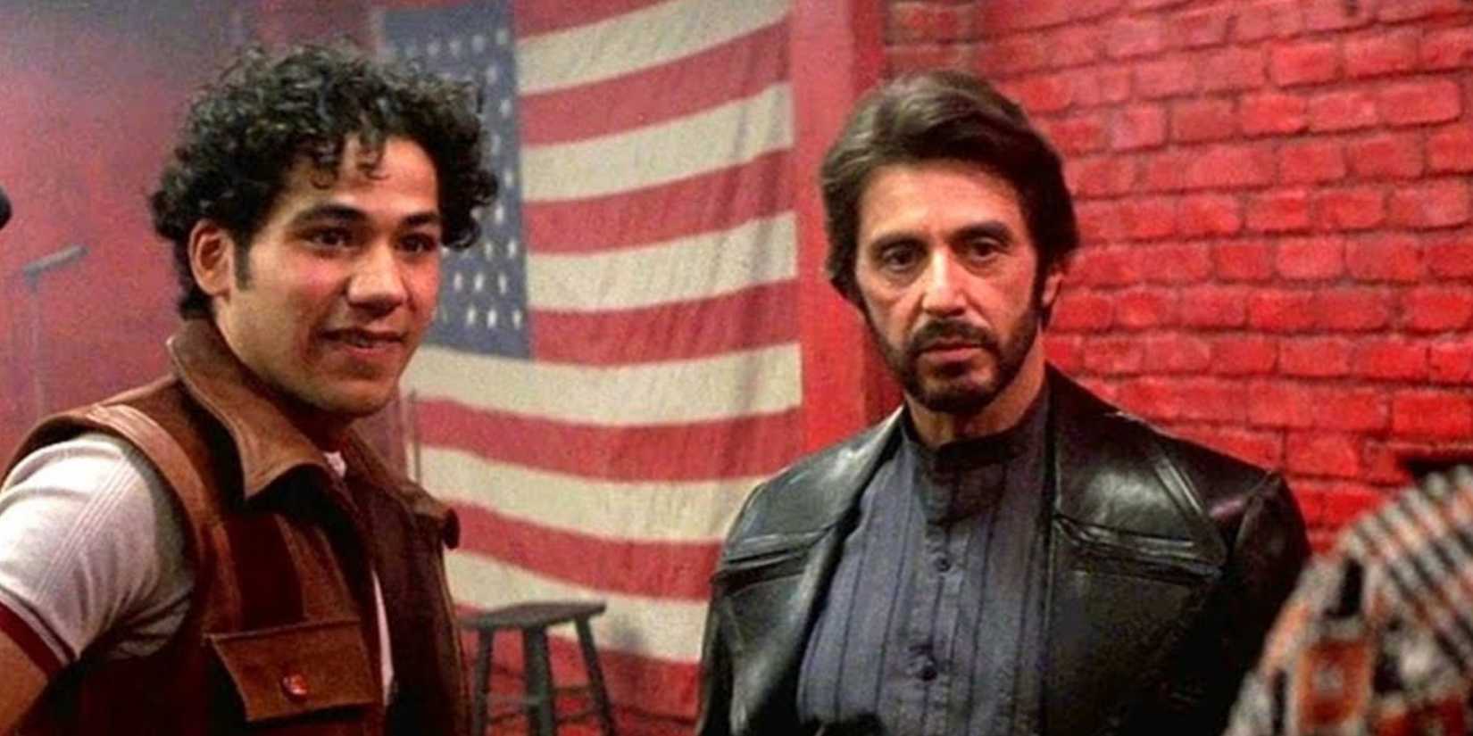 Al Pacino stands in front of an American flag like Carlito