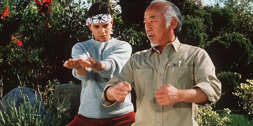 Mr. Miyagi teaches Daniel a fighting stance in The Karate Kid