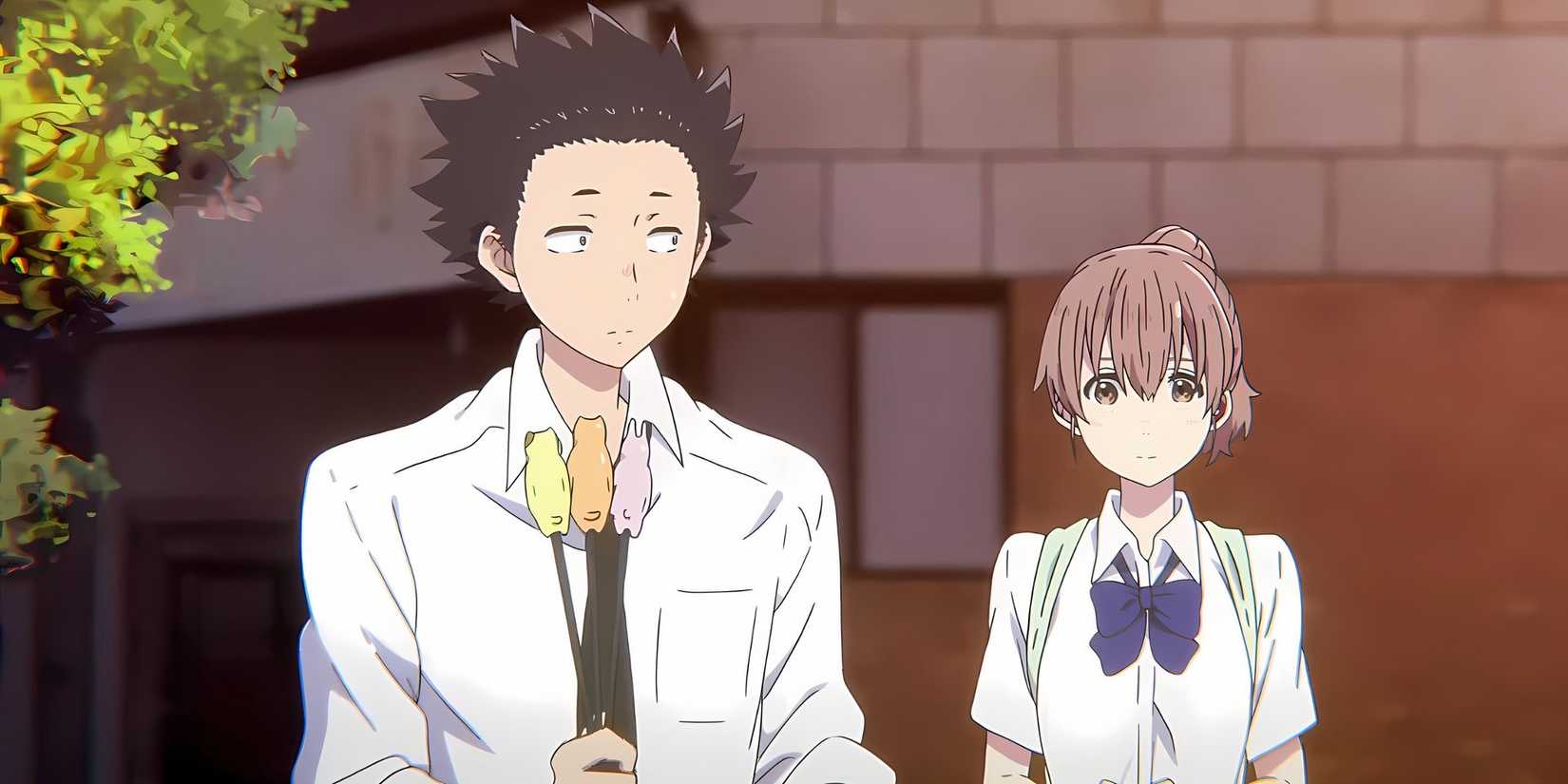Shoko with her hair in a ponytail stands behind Shoya in A Silent Voice
