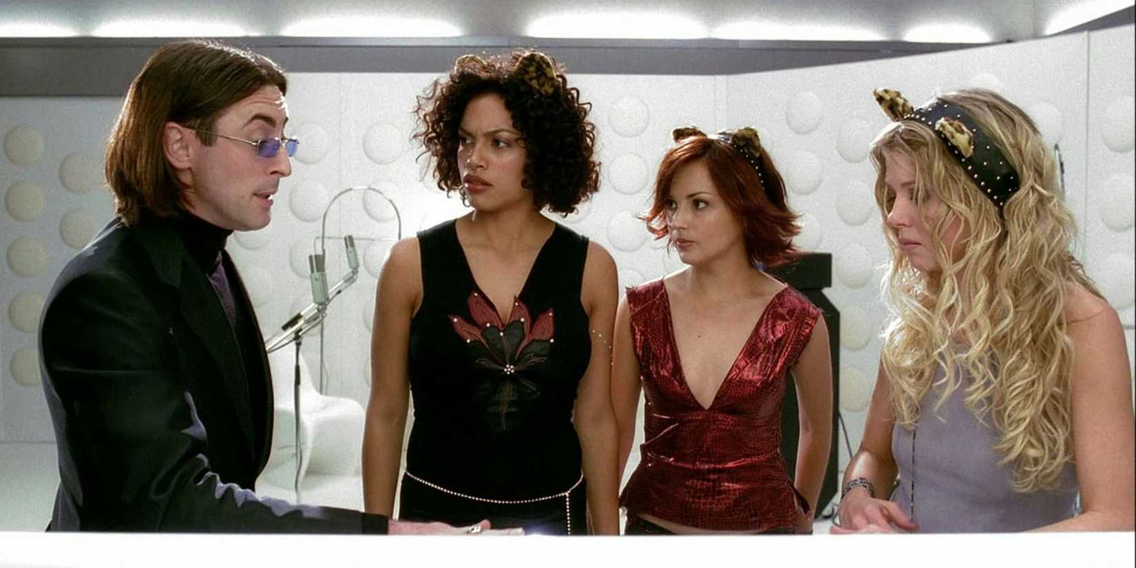 Josie McCoy, Melody Valentine and Valerie Brown talk to Wyatt Frame in Josie and the Pussycats.