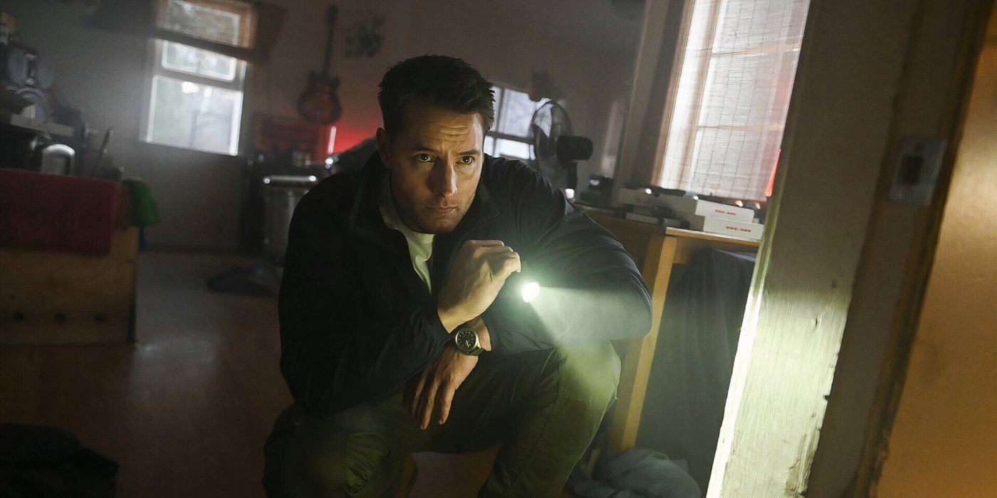 Colter crouched down shining a flashlight into a room on Tracker.