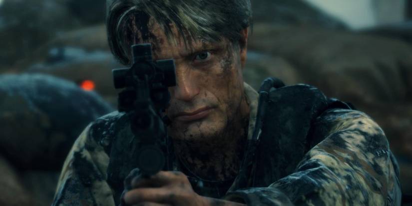 Cliff Unger from Death Stranding aiming his weapon in the middle of battle.