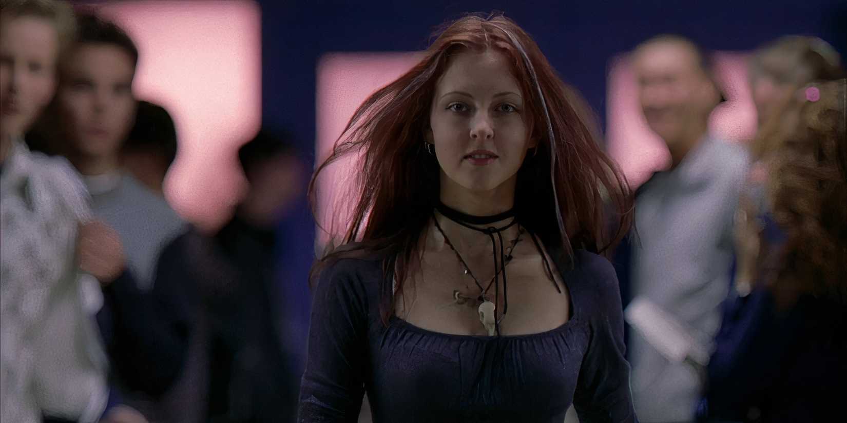 Ginger Fitzgerald is walking down the hallway in Ginger Snaps