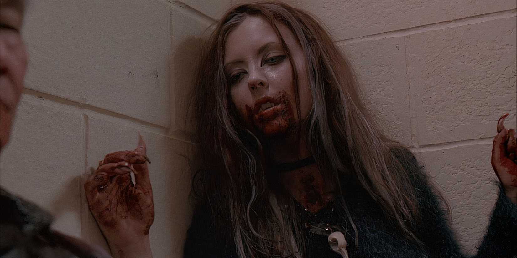 Ginger has just attacked someone as a werewolf in Ginger Snaps
