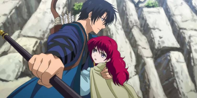 Hak is holding Yona close and holding out his weapon in Yona of the Dawn.