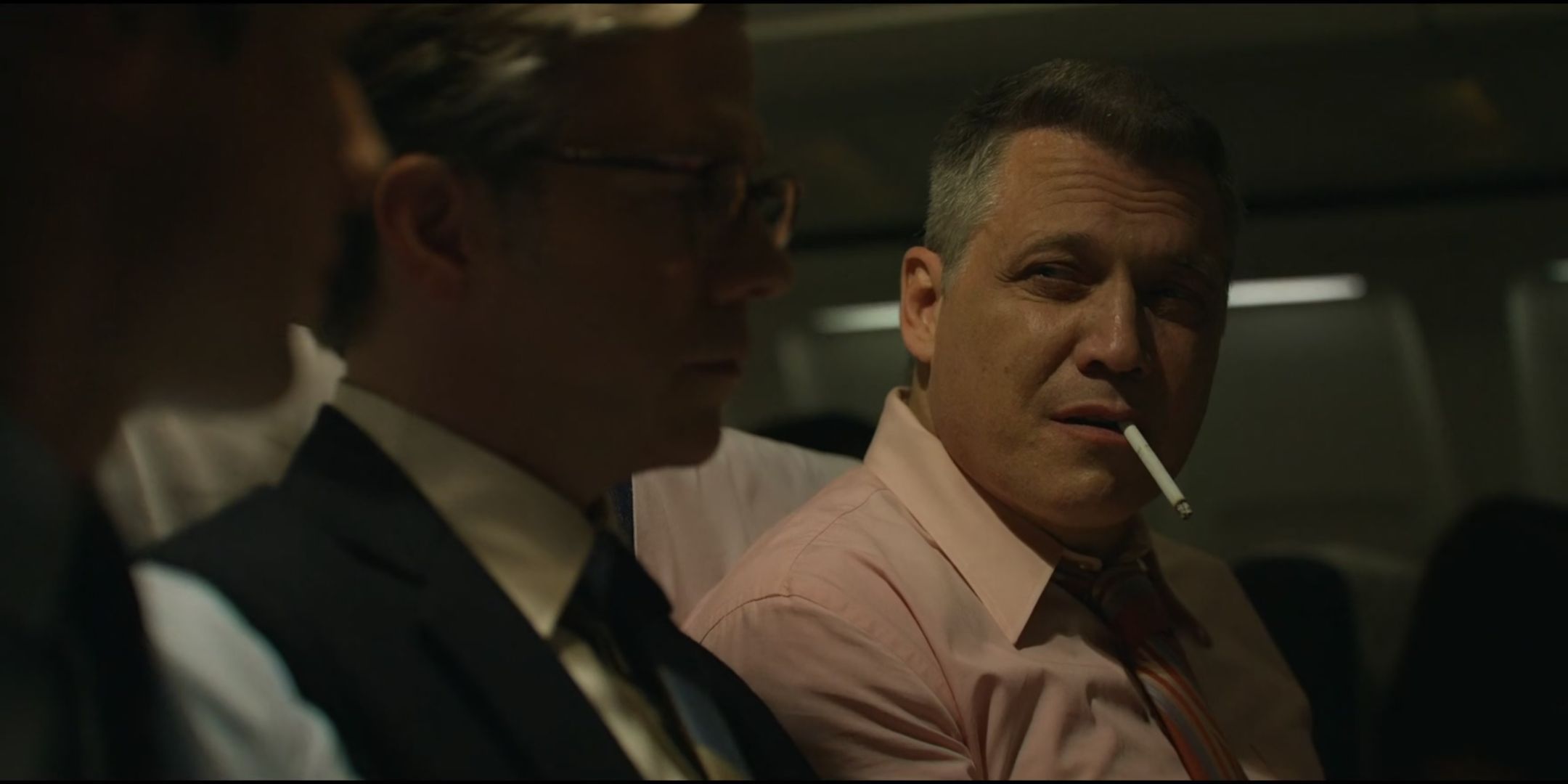 Holt McCallany as Bill Tench holds a cigarette in his mouth in Mind Hunter