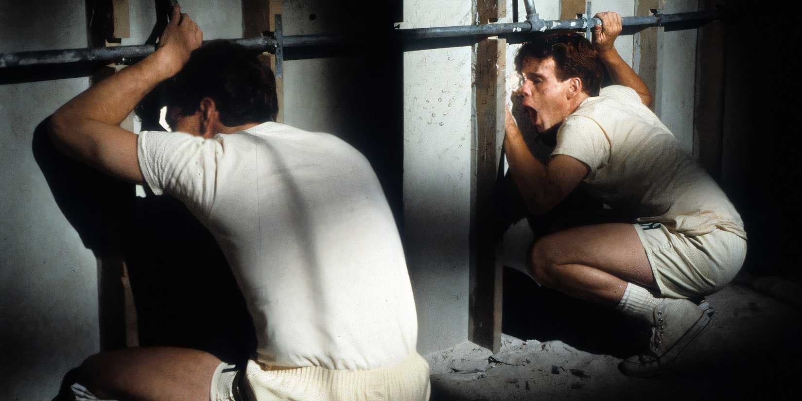 The boys are peeping at the girls in the locker room in Porky's.