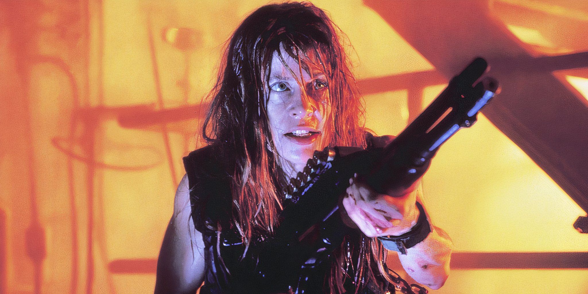 sarah connor holds a shotgun in the foundry.