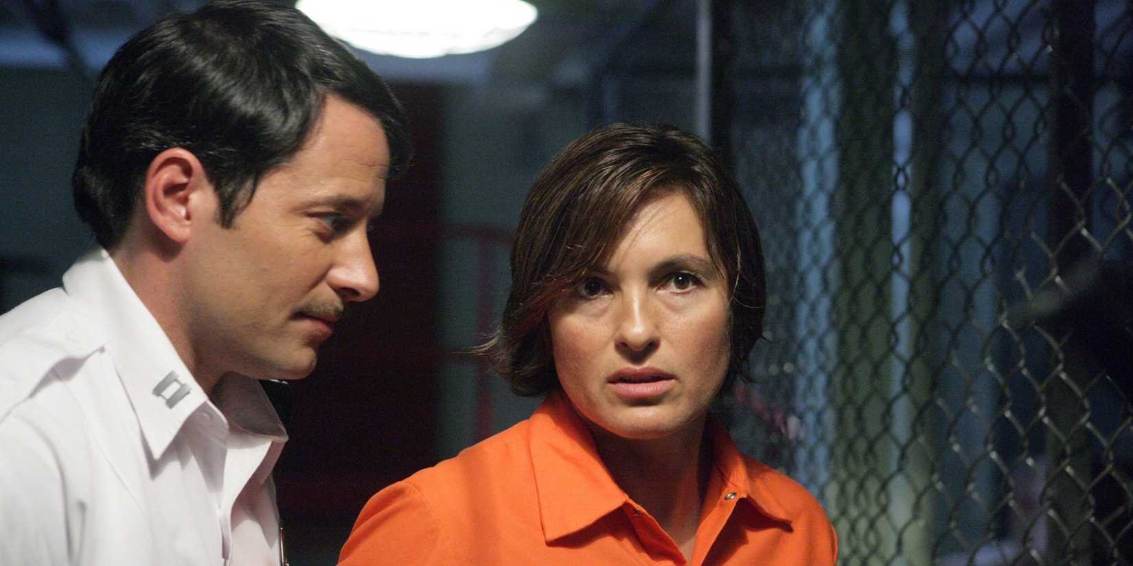 Mariska Hargitay's Olivia Benson in an orange prison uniform with a prison guard in Law & Order: SVU "Undercover"