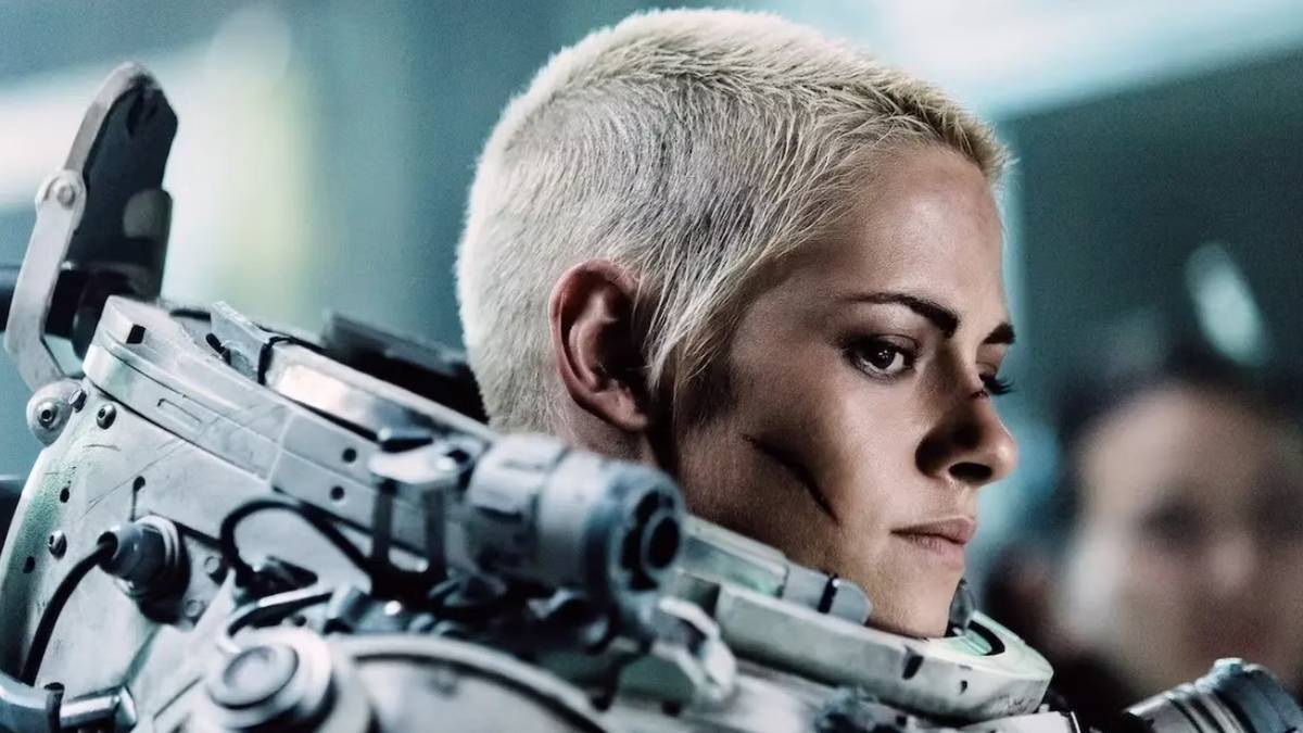 Kristen Stewart wears a suit, looking at something in Underwater.