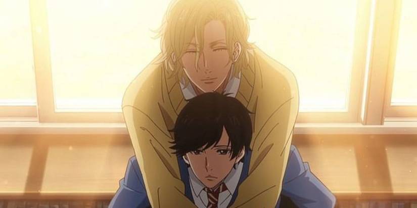Hisashi leaning over Mao’s shoulders as the twilight glows from behind them. 