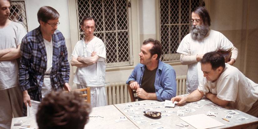 Various patients sit around a hospital table in One Flew Over the Cuckoo's Nest