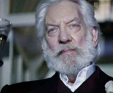 President Snow raising a glass of champagne