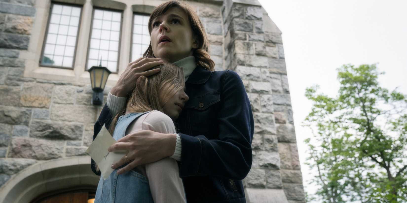 Kristen Bouchard kisses Lexis in front of the church from the series Evil Katja Herbers Maddy Corocco