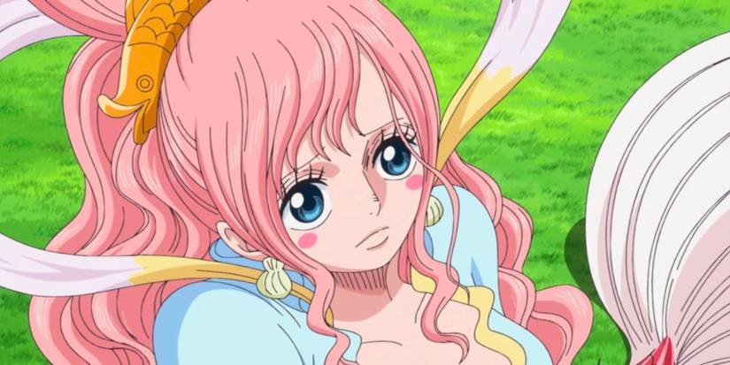 La princesse Shirahoshi de One Piece est assise sur un lit d'herbe avec une expression vide
