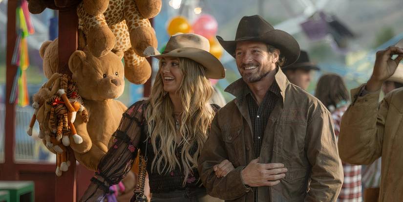 Ryan and Abby walking through a town fair in Montana in Yellowstone.