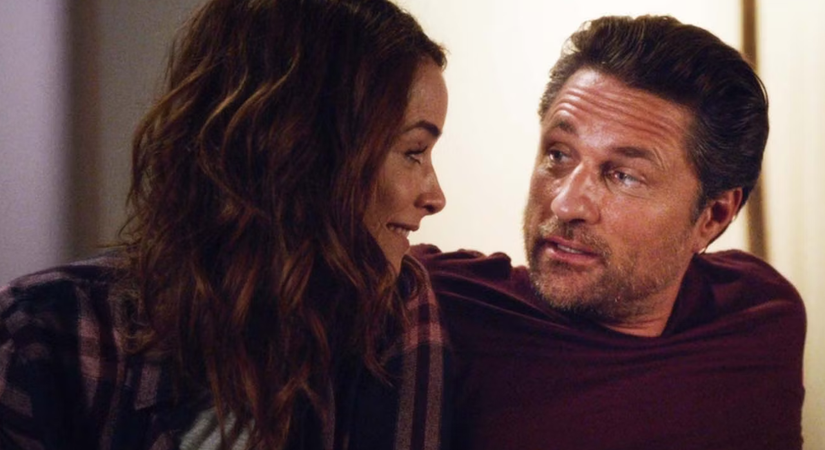 Nathan and Megan talk smiling at each other in Grey's Anatomy.