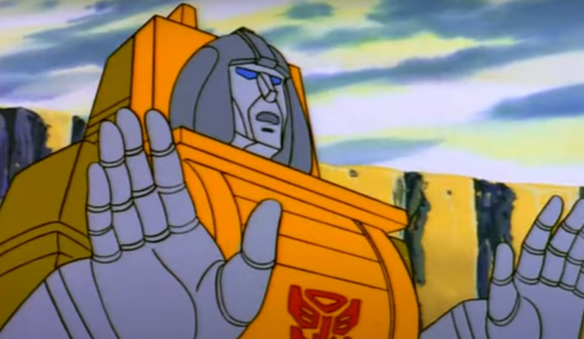 Brawn holds his hands out ready to lift Optimus Prime in The Transformers.