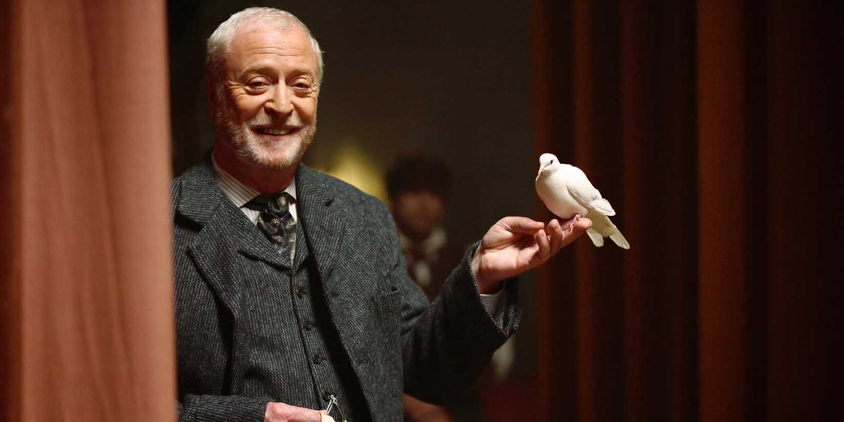 Michael Caine in The Prestige holding a bird.