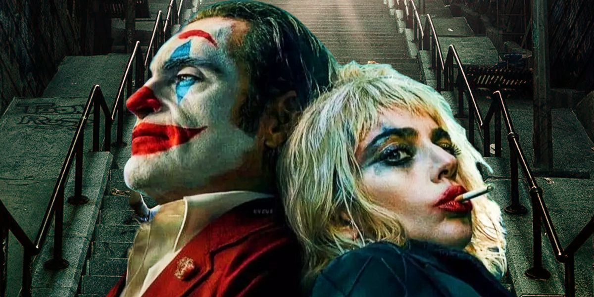 Joker (Joaquin Phoenix) and Harley Quinn (Lady Gaga) stand back to back with the Joker stairs behind them