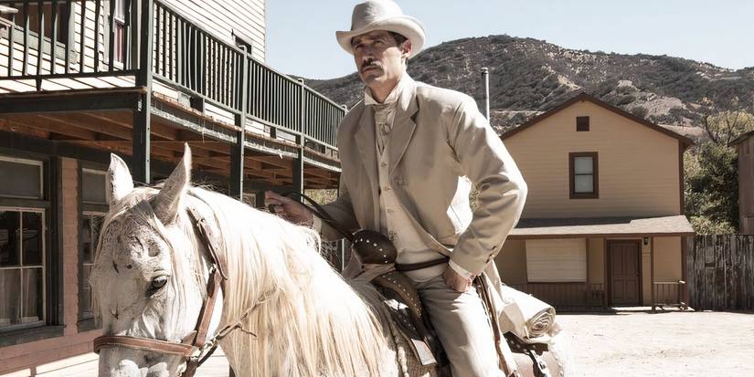 Matthew Fox rides into town on horseback in Bone Tomahwk.