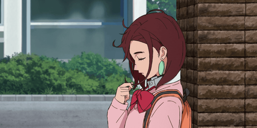 Momo Ayase at school gate in the Dandadan anime series