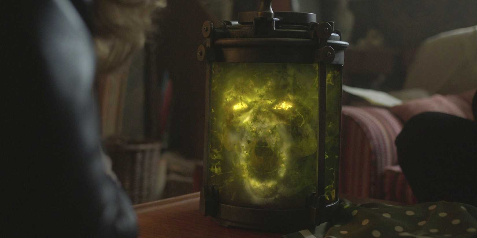 The Skull in a jar making a scary face in Lockwood & Co.