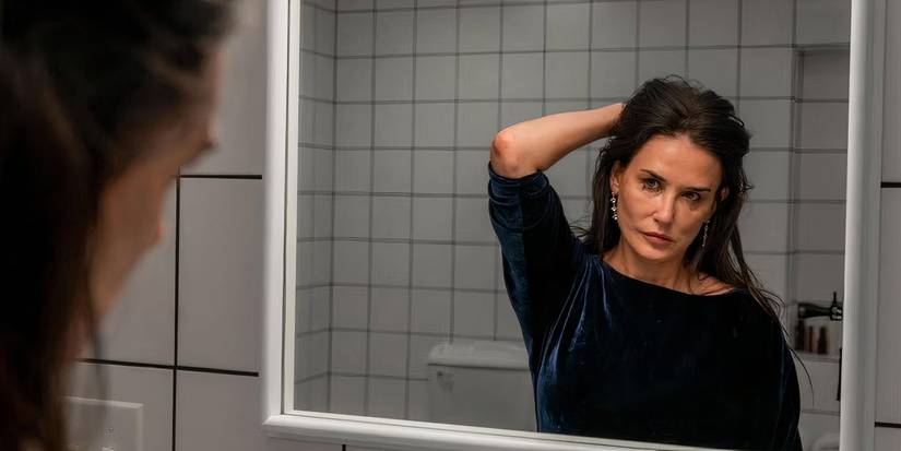 Elizabeth Sparkle is looking at herself in the mirror in The Substance