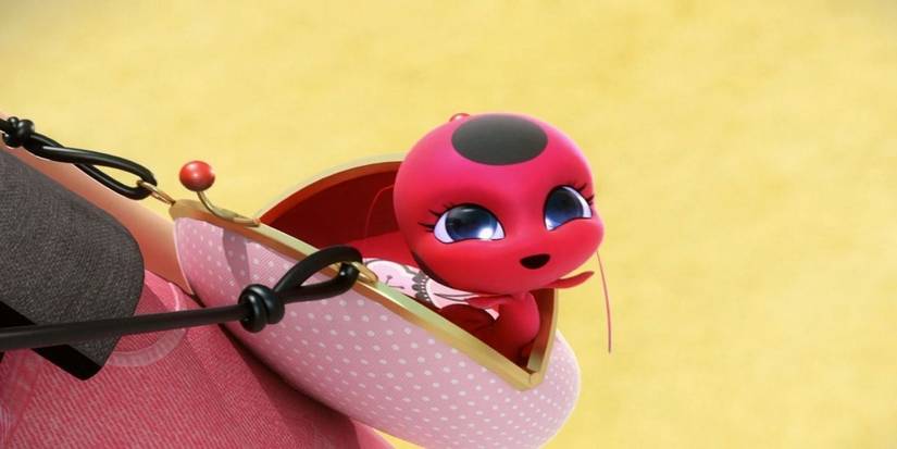 Tikki pops out of Marinette's bag in Miraculous Ladybug.
