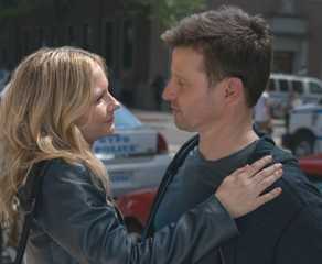 Eddie Janko stands looking fondly at Jamie Reagan with her hand on his shoulder in Blue Bloods