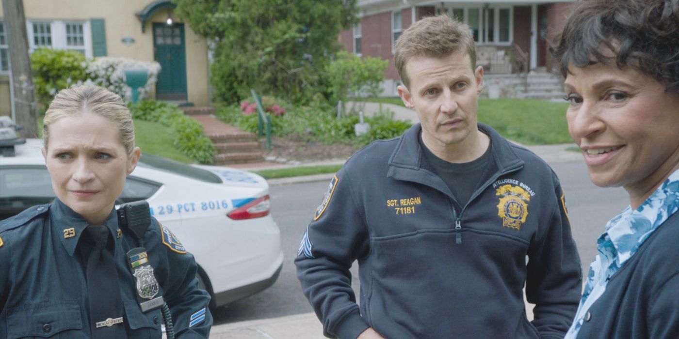 Eddie and Jamie Reagan, wearing police uniforms, speak with Badillo's mom in Blue Bloods Season 14
