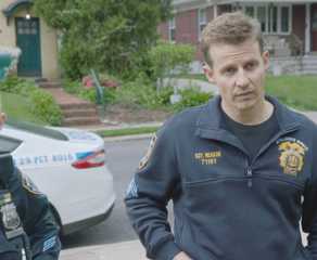 Eddie and Jamie Reagan, wearing police uniforms, speak with Badillo's mom in Blue Bloods Season 14