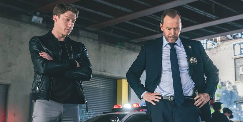 Joe Hill (Will Hochman) and Danny Reagan (Donnie Wahlberg) stand at a crime scene in Blue Bloods