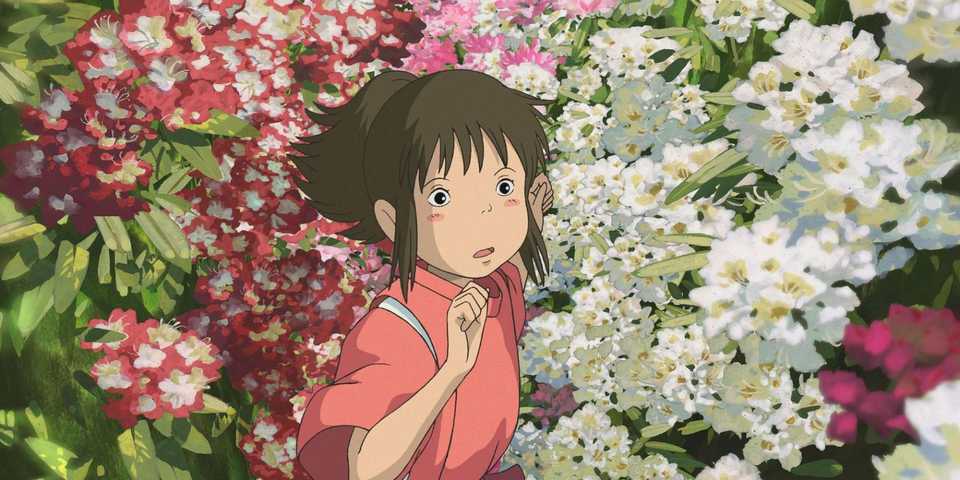 Film Spirited Away karya Studio Ghibli menampilkan Chihiro berlari menuju Haku di antara bunga-bunga.