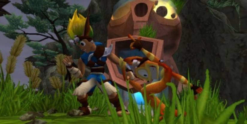 Jak and Daxter celebrate the acquisition of a Power Cell in Jak and Daxter: The Precursor Legacy.