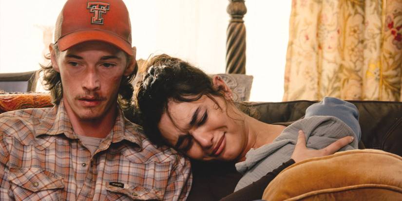 Adriana holds her baby while crying on an awkward Cooper's shoulder in Landman