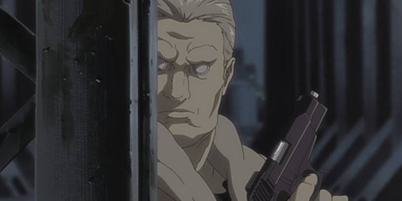 Batou hides behind a steel pillar with his gun drawn in Ghost in the Shell: Stand Alone Complex.