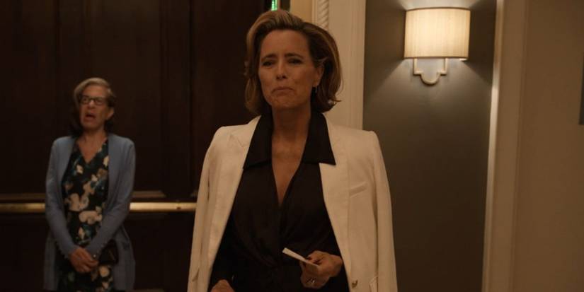 Sofia emerges from the elevator, Uma in the background inside the elevator in murders only in the building.