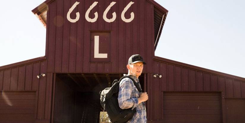 Jimmy Hurdstrom (Jefferson White) is standing in front of a barn with the number 6666 on it in Yellowstone.