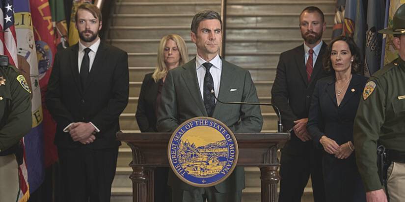 Jamie Dutton, played by actor Wes Bentley, stands at a podium with his staff in Yellowstone Season 5