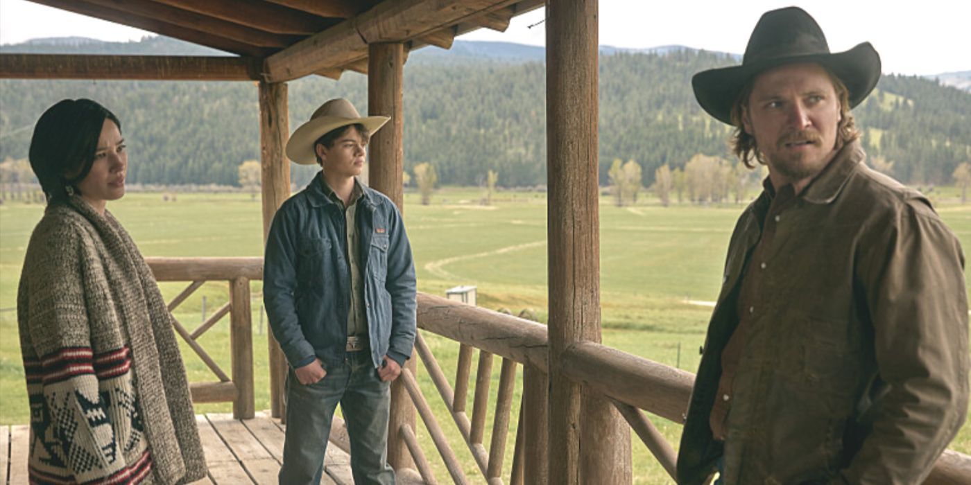 Monica Long Dutton, Tate Dutton and Kayce Dutton stand on the porch of a log cabin in Yellowstone