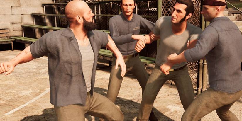 One of the playable character from A Way Out being assaulted by prisoners.